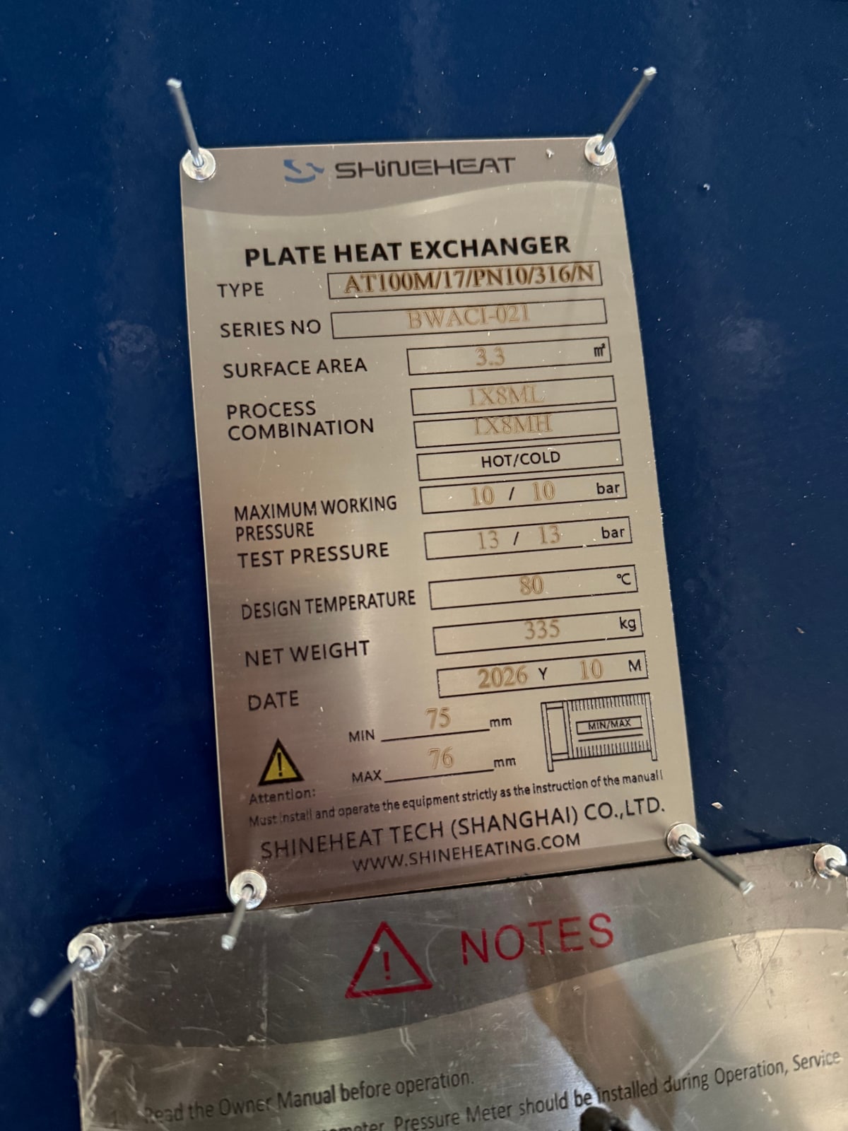 Original SHINEHEAT nameplate photograph for a second pre-assembled heat exchanger reference